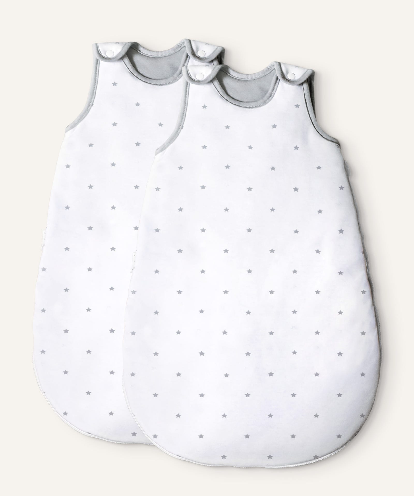 2er Bundle Ehrenkind Baby-ganzjahresschlafsack rund in Weiß mit graue Sterne.