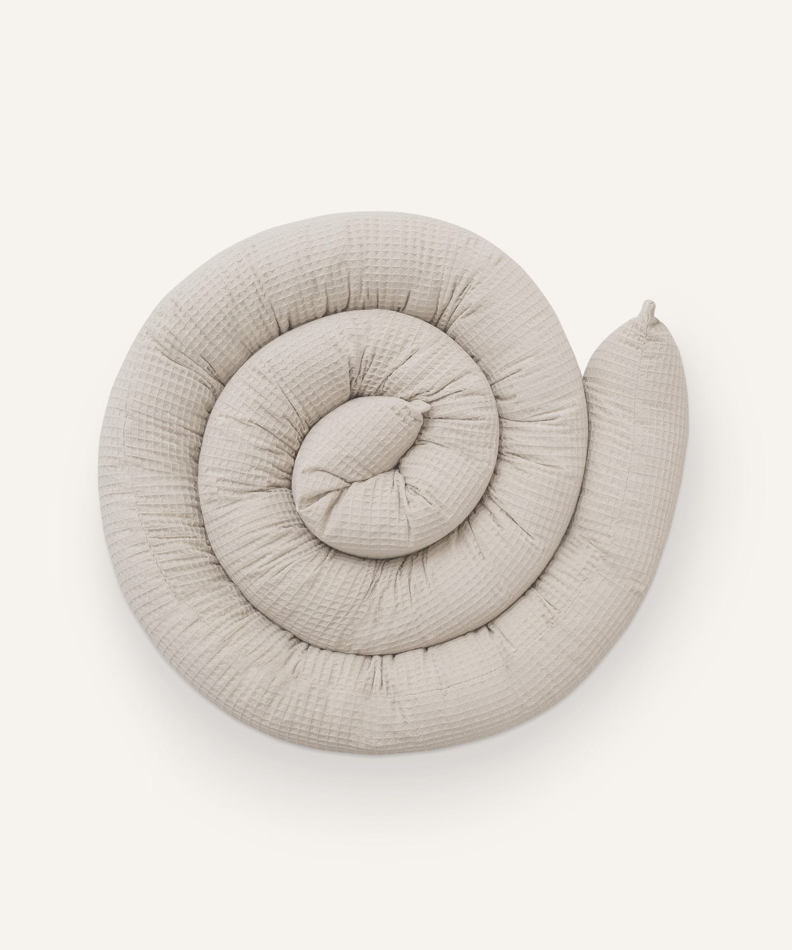 Bettschlange in Beige.