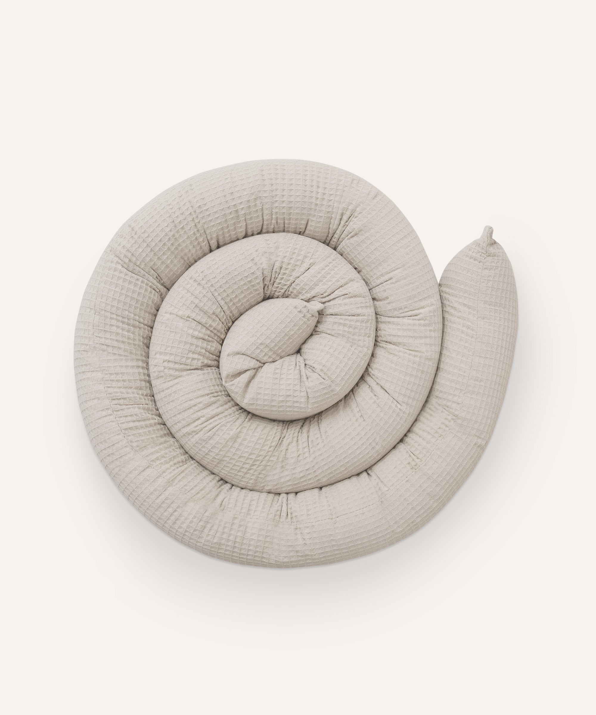 Bettschlange in Beige.