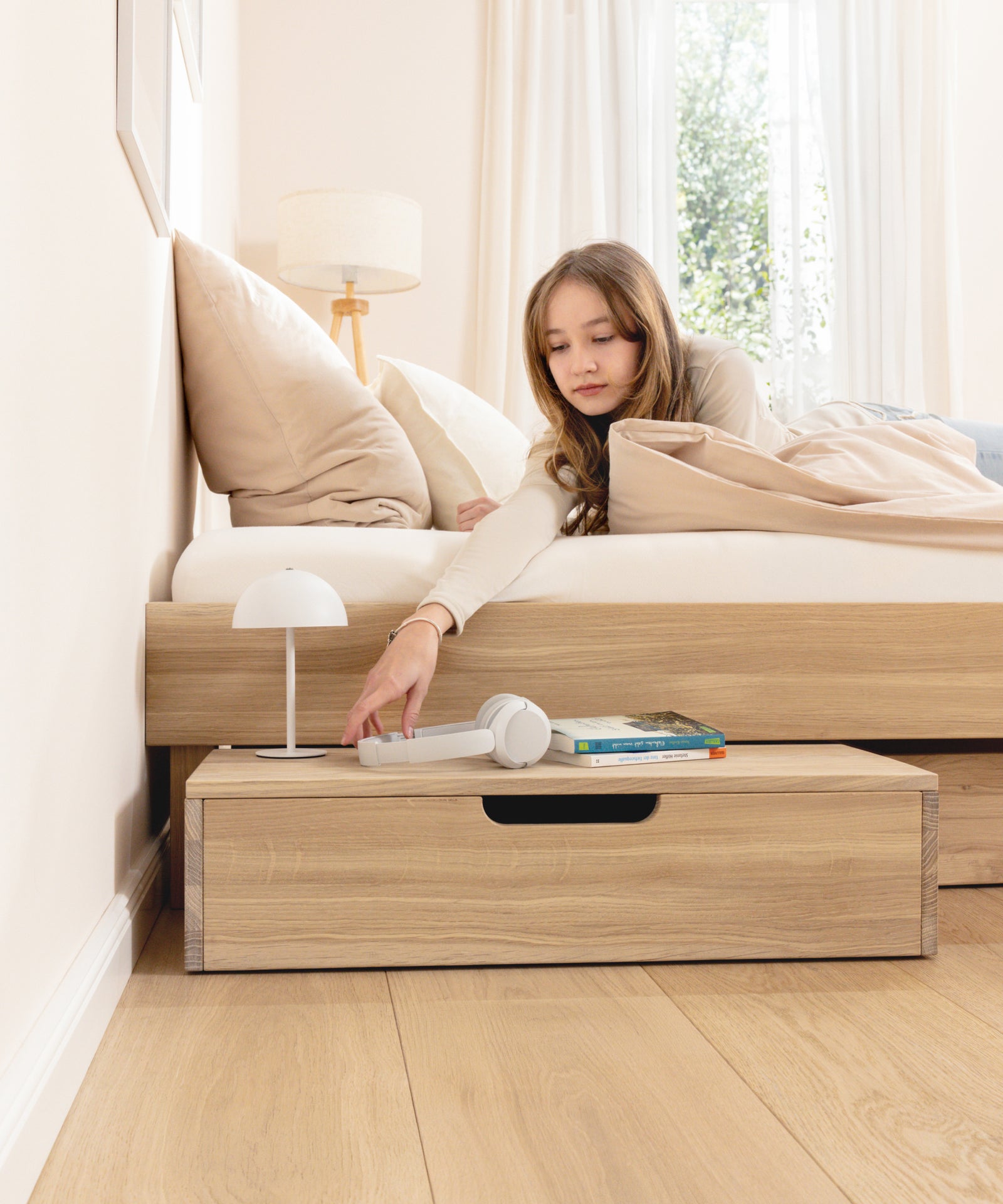 Jugendbett mit optionalen Schubladen für zusätzlichen Stauraum.